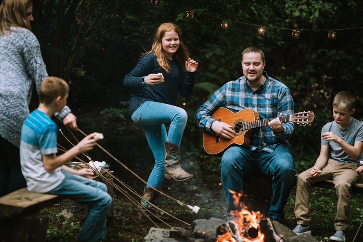 Family Fun Around A Campfire With Music and Food